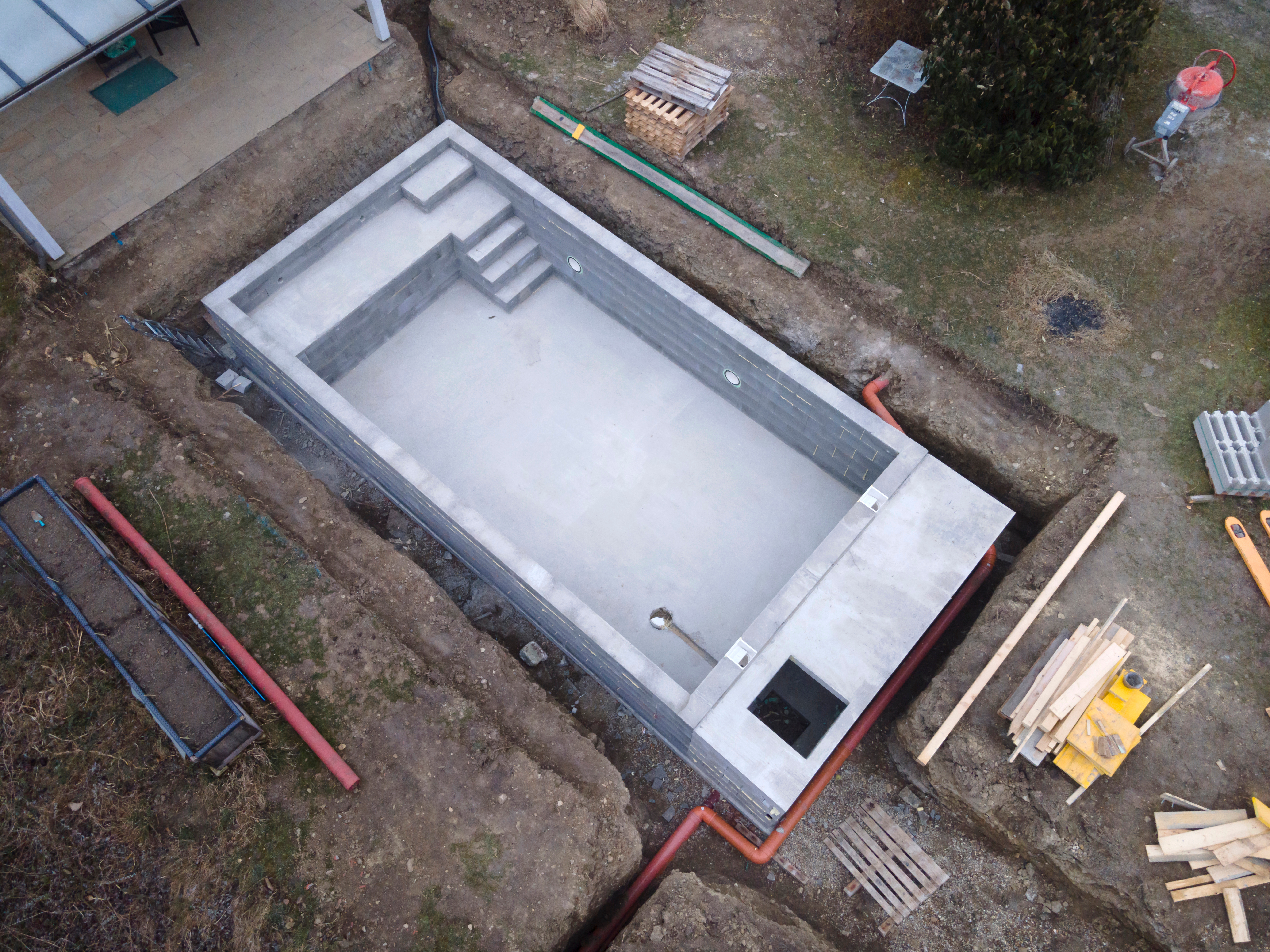 drone,photo,of,pool,construction,site,in,a,garden,in drone,photo,of,pool,construction,site,in,a,garden,in